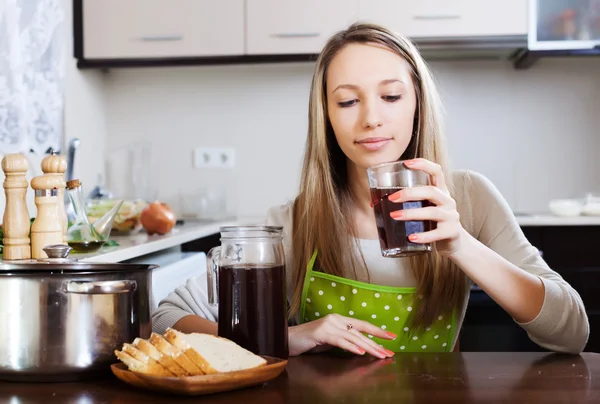 Blonde woman drinking  kvass from glass — Stock Photo, Image