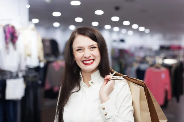 Ordinary woman at clothing store — Stock Photo, Image