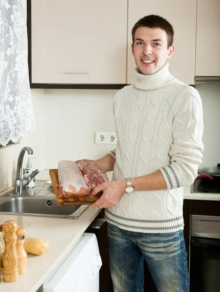 Ordinary guy cooking meat — Stock Photo, Image