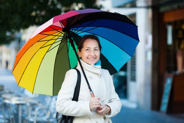 Mature woman with umbrella — Stock Photo, Image