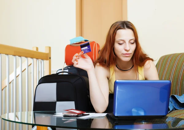 Woman buying tickets or reserving resort online — Stock Photo, Image