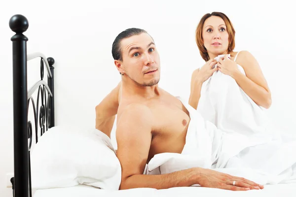Loving couple caught in bed — Stock Photo, Image