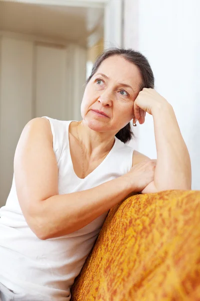 Pensive mature woman in home — Stock Photo, Image