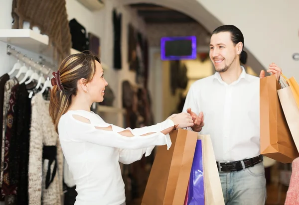 Happy couple with shopping bags Stock Picture
