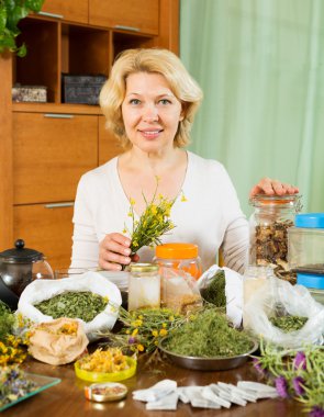 mature woman doing herbal tea   clipart