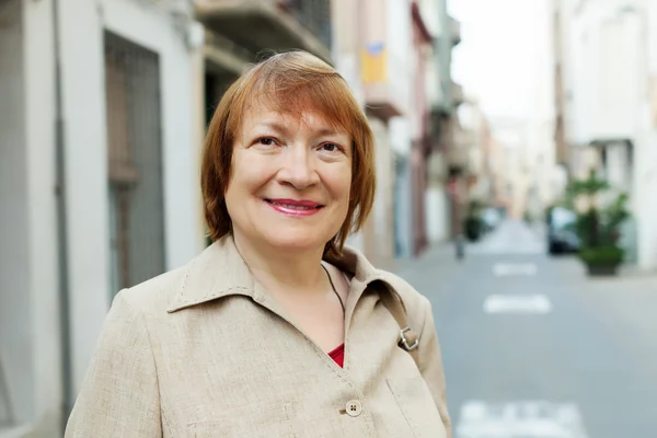 Mature woman at European town — Stock Photo, Image