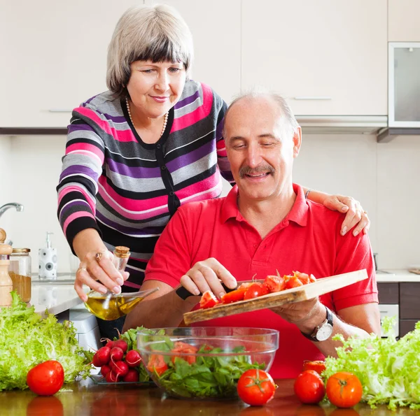 Mature couple cooking  together — Stock Photo, Image