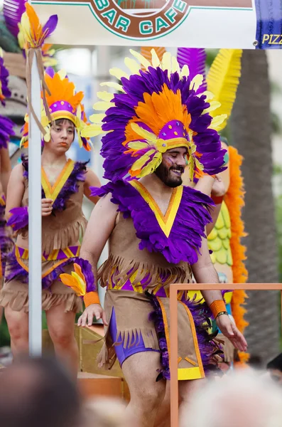 Guys in colored feathers at Gay pride parade — Stock Photo, Image