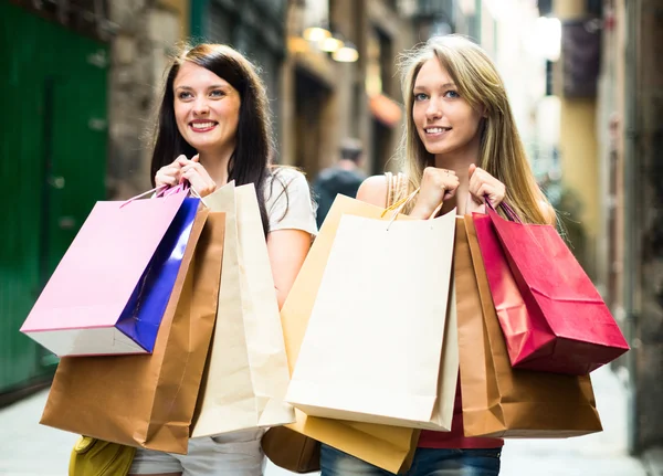 Two happy young girl going shopping Stock Photo