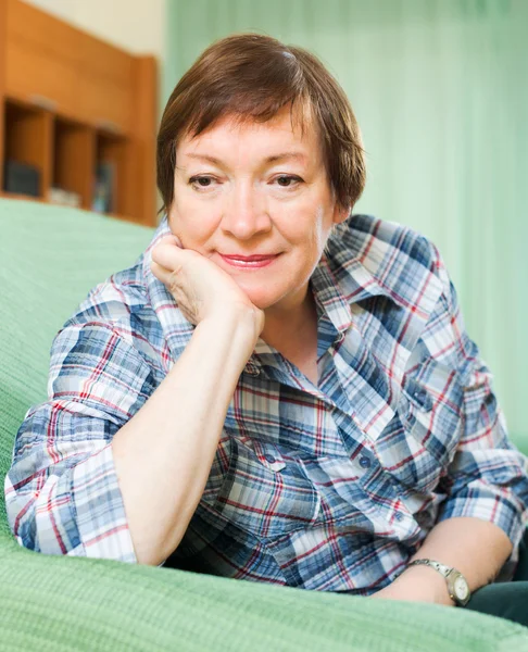 Stressed female pensioner on couch — Stock Photo, Image