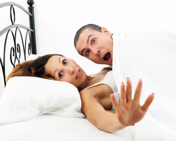 Couple caught  in bed — Stock Photo, Image