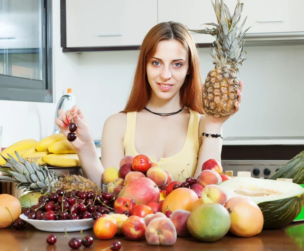Long-haired woman with pineapple — Stock Photo, Image