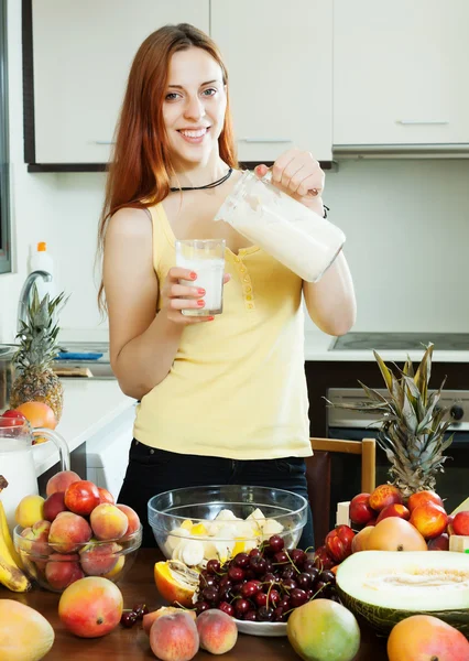 Happy woman drinking milk cocktail — Stock Photo, Image