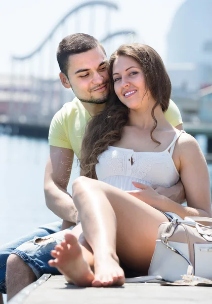 Happy couple taking sunbath — Stock Photo, Image