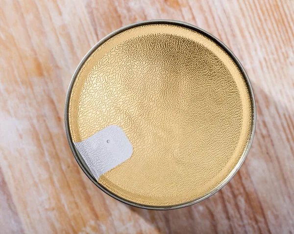 Close-up of canned food on wooden surface — Stock Photo, Image