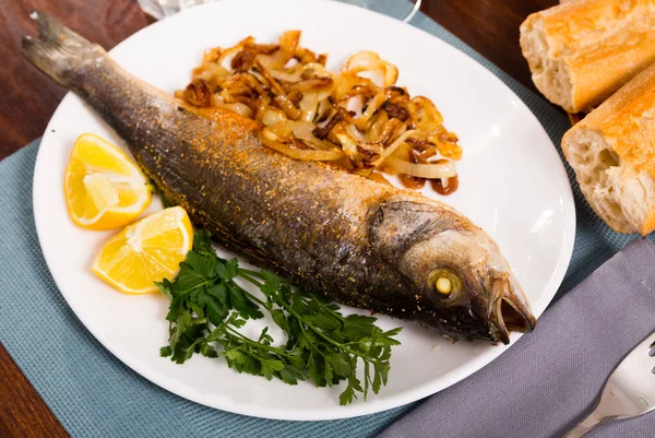 Oven baked sea bass fish — Stock Photo, Image