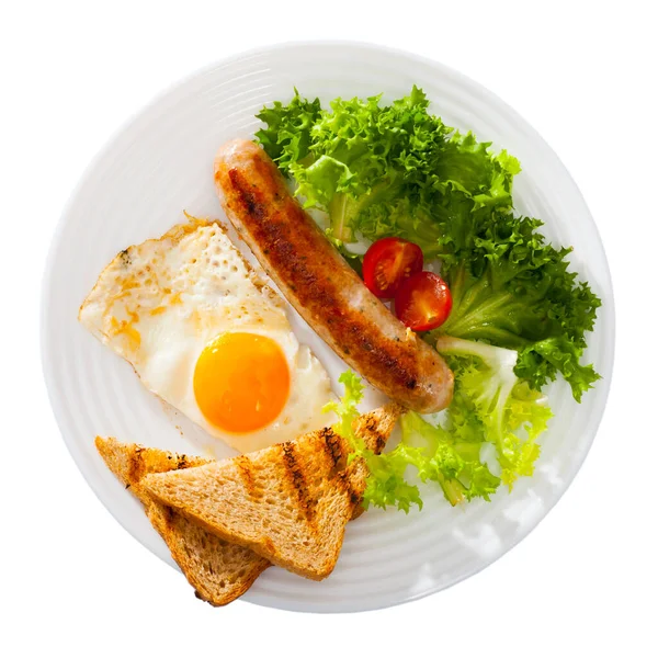 Leckeres Frühstück mit Wurst, Speck, Rührei — Stockfoto