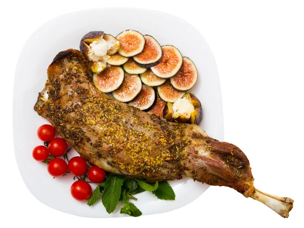 Tasty shoulder of lamb baked in oven with honey, served with fig, feta cheese and herbs — Stock Photo, Image