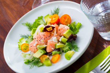 Ceviche of trout with avocado, cumquat, greens clipart