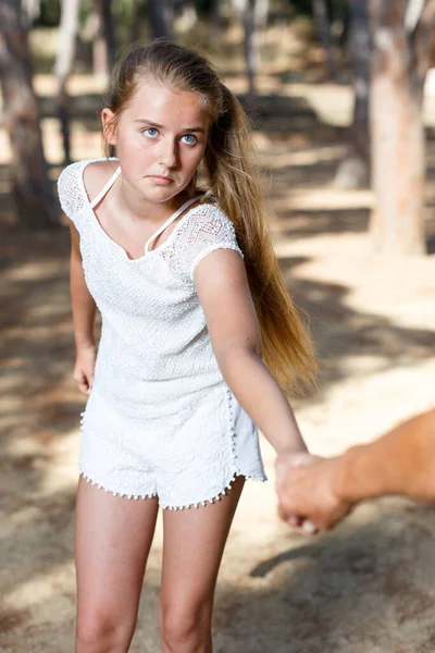 Teenage girl hold grandmother on hand in green park at summer day — Stock Photo, Image