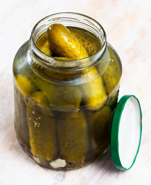 Marinated cucumbers in glass jar — Stock Photo, Image