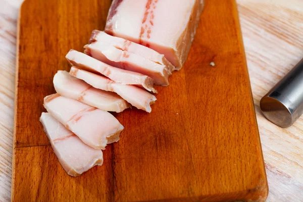 Appetizing salted pork belly on a cutting board — Stock Photo, Image