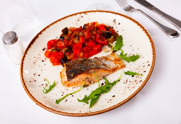 Portion of steamed salmon fillet with eggplants and tomatoes — Stock Photo, Image