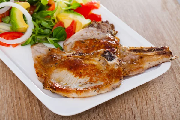 Pork chops with vegetable salad — Stock Photo, Image