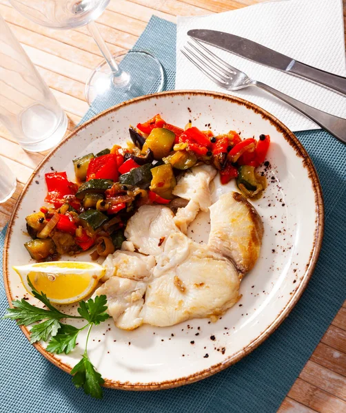 Prepared blue shark served with fried vegetables on plate on wooden table — Stock Photo, Image