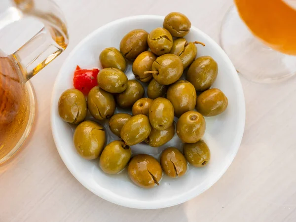 Pickled green olives with a stone — Stock Photo, Image