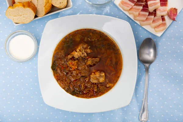 Portion of borsch served on table — Stock Photo, Image