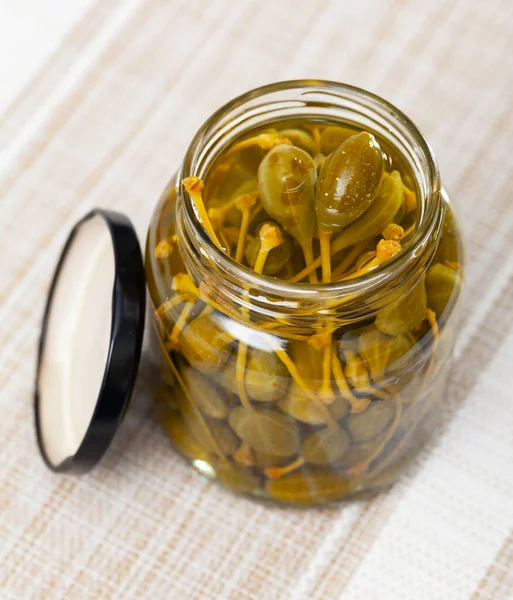 Glass jar with pickled green capers — Stock Photo, Image