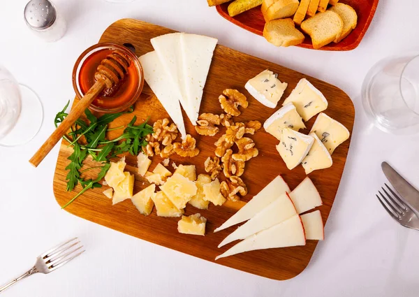 Cheese Board Different Types Delicious Cheese Wooden Cutting Board — Stock Photo, Image