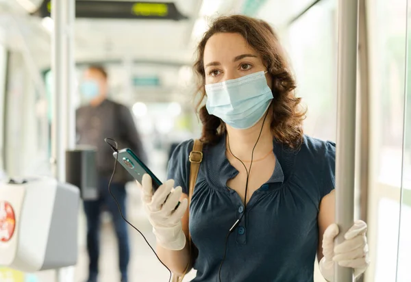 Young Woman Mask Protective Gloves Riding Modern Tram Spring Day — Stock Photo, Image