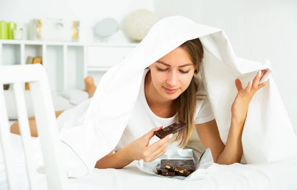 Happy Girl Hiding Sheet Sweets Indoors High Quality Photo — Stock Photo, Image