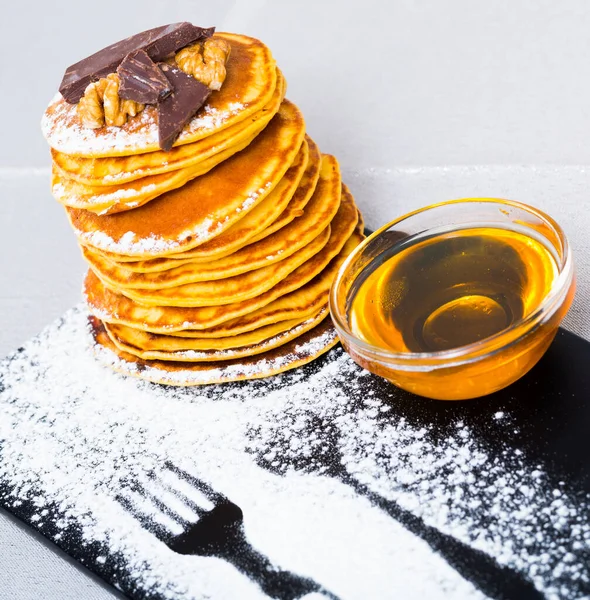 Stack Delicious Pancakes Black Plate Chocolate Walnuts Honey — Stock Photo, Image