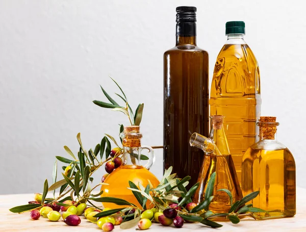 Fresh Olive Oil Bottles Olives Branches Wooden Table — Stock Photo, Image