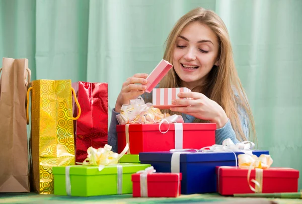 Girl Sitting Table Gifts Opening One Box — Stock Photo, Image