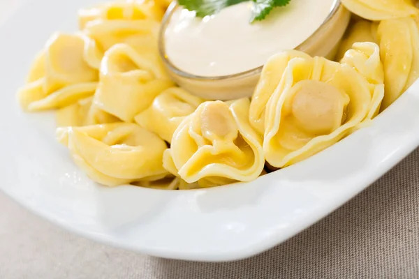 Closeup Traditional Italian Ravioli Served White Plate Sour Cream Sauce — Stockfoto