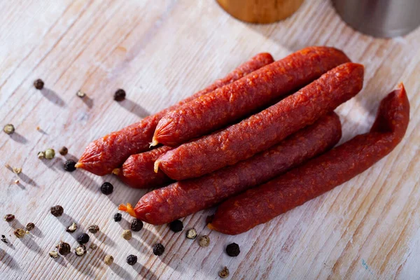 Traditional Dry Cured Tyrolean Sausages Chilli Wooden Table — Fotografie, imagine de stoc