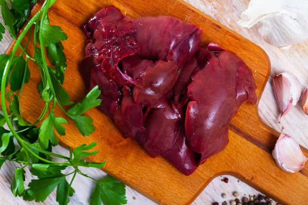 Raw rabbit liver with natural ingredients before cooking, nobody