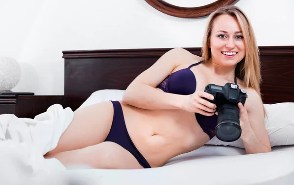 Happy Smiling Blond Woman Underwear Sitting Bed Taking Pictures Camera — Stock fotografie