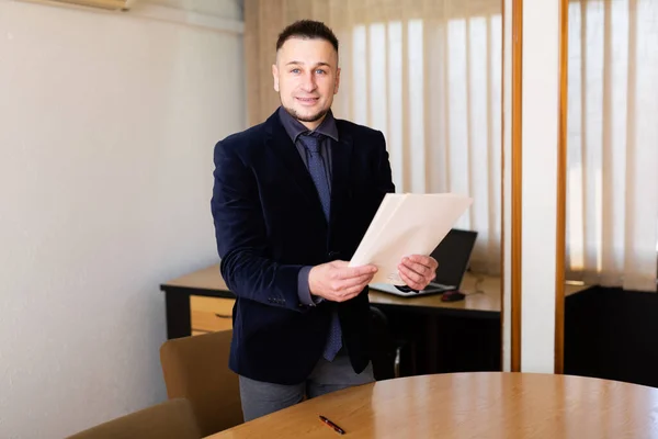 European Man Standing Office Holding Documents Hands Looking Camera — Stock fotografie