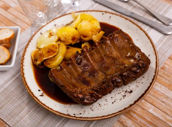 Roasted Pork Ribs Fried Potatoes Served Plate Seasoned Salsa Sauce — Stok fotoğraf