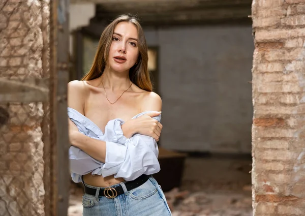 Young Woman Blue Jeans Open Shirt Slightly Revealing Her Breast — стоковое фото