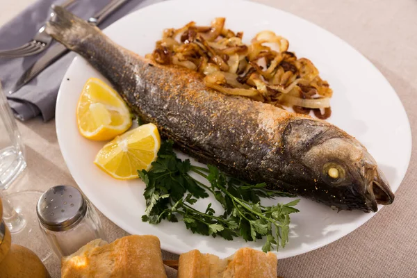 Plate Tasty Fish Dish Baked Sea Bass Served Fried Onion — Stock Photo, Image