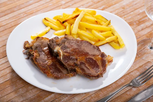 Appetizing Roasted Bone Pork Chop Side Dish Crispy French Fries — Stock Photo, Image