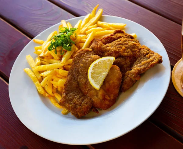 Dish of Czech cuisine - Smazeny veprovy rizek - breaded pork steak.