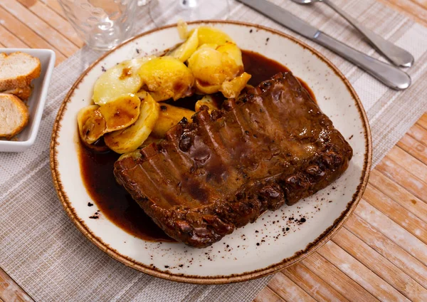 Roasted Pork Ribs Fried Potatoes Served Plate Seasoned Salsa Sauce — Stok fotoğraf