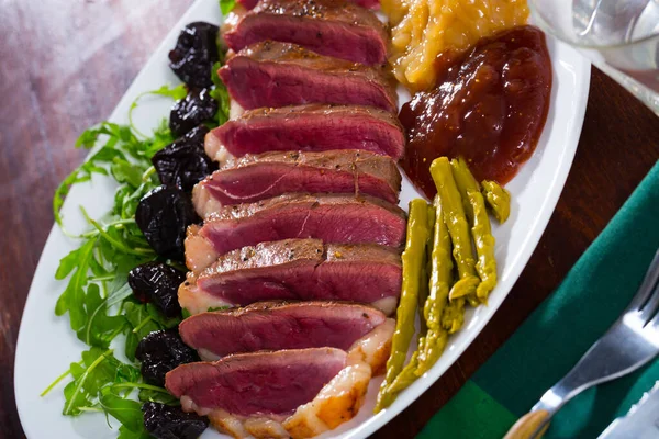 Tasty Grilled Duck Magret Fillet Served Greens Prunes Asparagus Sauce — Stock Photo, Image